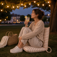 portable chair with stripes in park